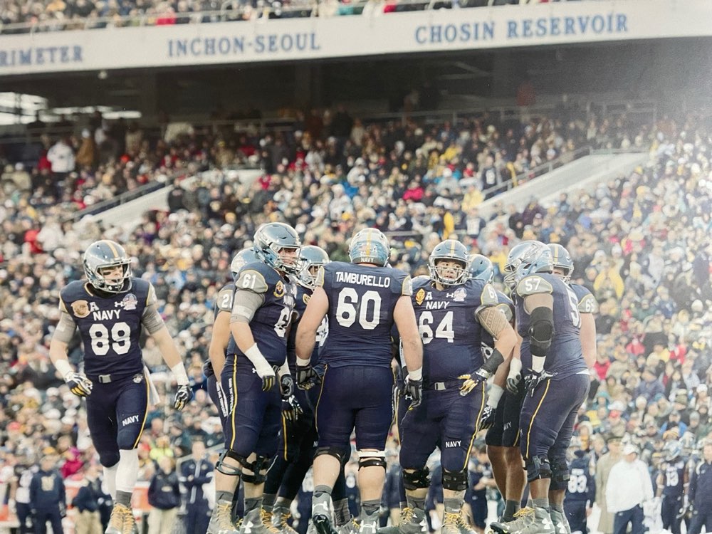 Ben Tamburello, number 60, in the huddle at the Army-Navy Game